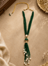 Teal green beaded tassel necklace with oval gold-tone pendant and pearl tassels