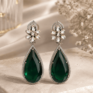 Floral teardrop statement earrings with crystal flower tops and dark green gemstone drops