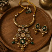 Gold-tone heritage necklace set with green and pink stones, plus pearl drop earrings