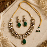 Gold-tone heritage necklace set with green teardrop pendant and beadwork dangle earrings