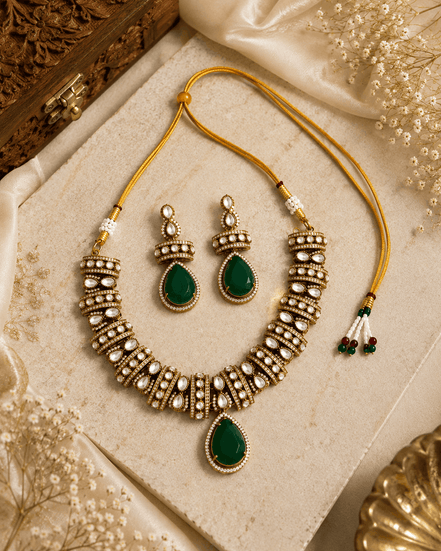 Gold-tone heritage necklace set with green teardrop pendant and beadwork dangle earrings