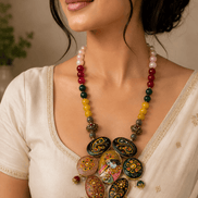 Multicolor beaded statement necklace with round hand-painted pendants and dangling charms