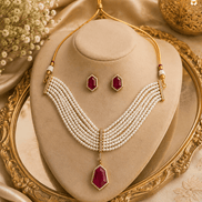 Gold-tone pearl necklace set with maroon pendant and matching stud earrings