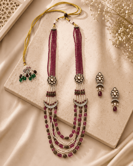 Ruby pink layered beaded necklace with tassel drops and matching stud earrings