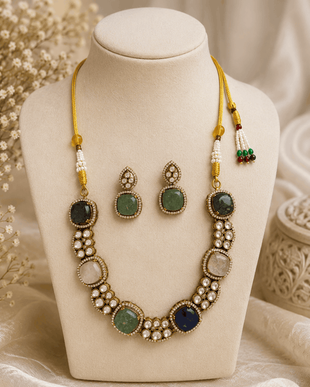 Gold-tone multicolor gemstone necklace with round cabochon beads and oval stud earrings