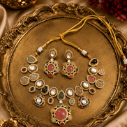 Kundan-style necklace set with oval green and pink stones, gold-tone stud and drops