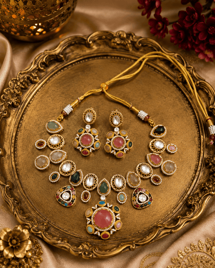 Kundan-style necklace set with oval green and pink stones, gold-tone stud and drops