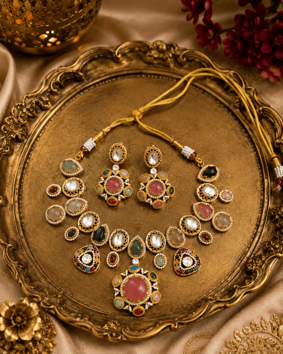 Kundan-style necklace set with oval green and pink stones, gold-tone stud and drops
