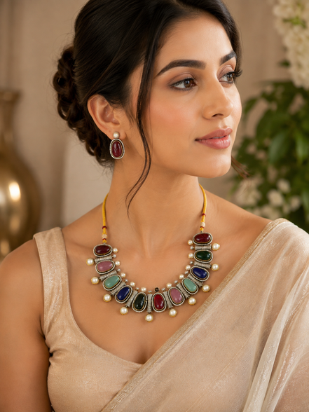 Mahira Heritage necklace set with multicolor oval stones and pearls, with drop earrings.
