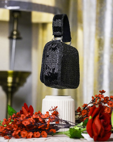 Black crystal mini bag with top handle and faceted beaded texture