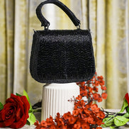 Black crystal mini bag with top handle and rounded beaded body