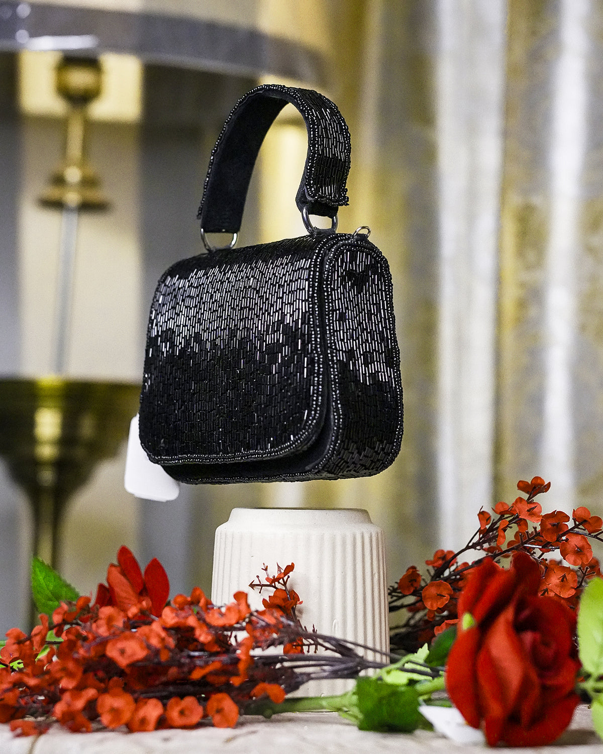 Black crystal mini bag with top handle and rounded beaded design