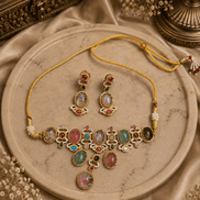 Gold-tone necklace with multicolor teardrop stones and matching earrings set