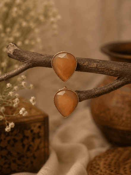 Amber orange teardrop stud earrings with faceted stones