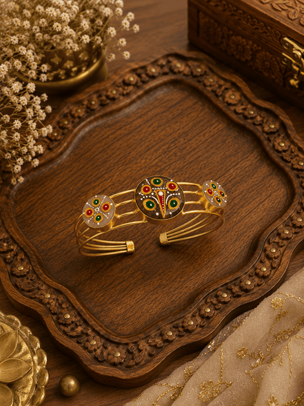 Gold-tone cuff bracelet with multicolor enamel peacock motif and small round accents