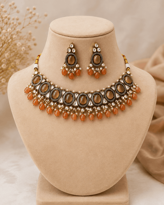 Amber-tone choker necklace set with matching drop earrings, dark oval beads and orange drops