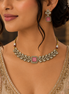 Ruby-pink square-stone choker necklace with gold filigree and stud drop earrings on model.