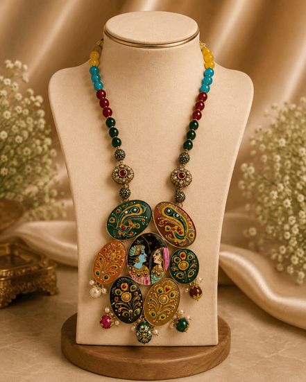 Statement necklace on bust stand with multicolor beads and round hand-painted pendant cluster