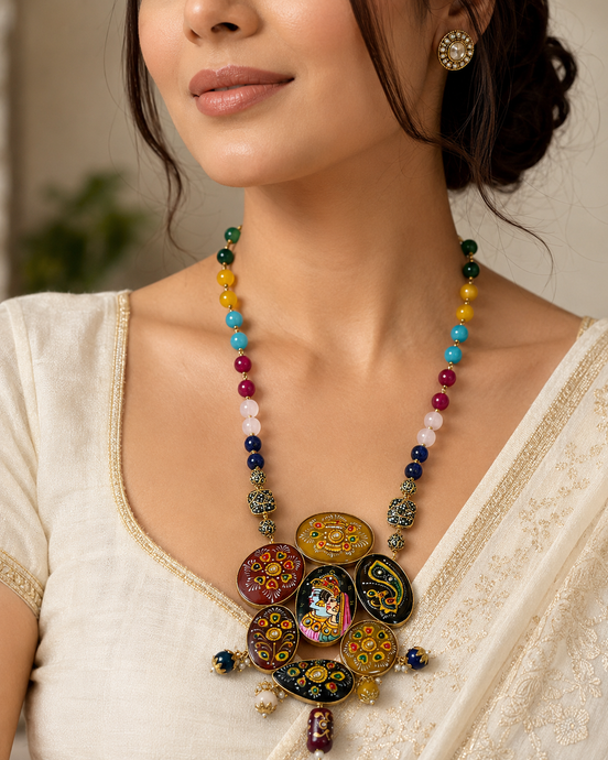 Multicolor beaded statement necklace with circular hand-painted pendants and dangling charms