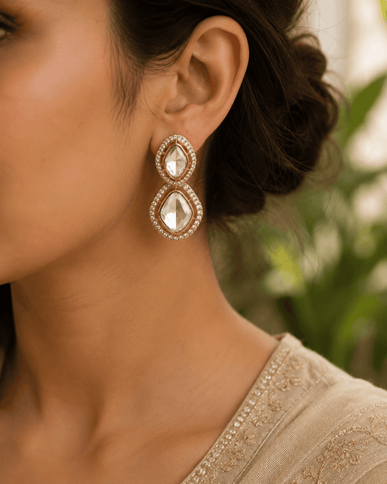 Gold-tone double drop stud earrings with clear oval stones and crystal halo detailing