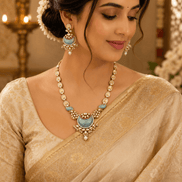 Gold-tone necklace set with peacock-blue enamel pendant and matching drop earrings