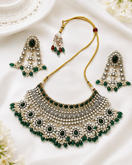 Kundan bridal necklace and matching earrings with emerald green stones and pearl beadwork