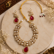 Gold-tone heritage necklace set with red teardrop pendant and beadwork stud earrings