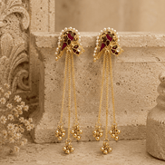 Gold-tone tassel earrings with ruby-pink and teal cabochon studs and long bead fringe chains