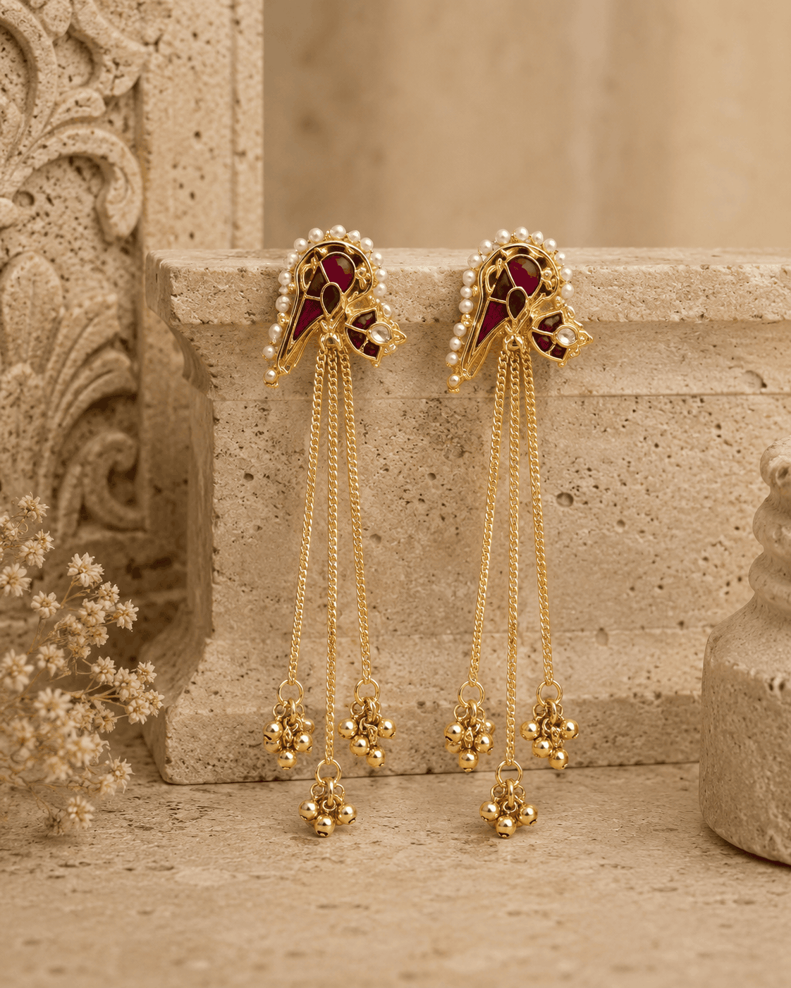 Gold-tone tassel earrings with ruby-pink and teal cabochon studs and long bead fringe chains
