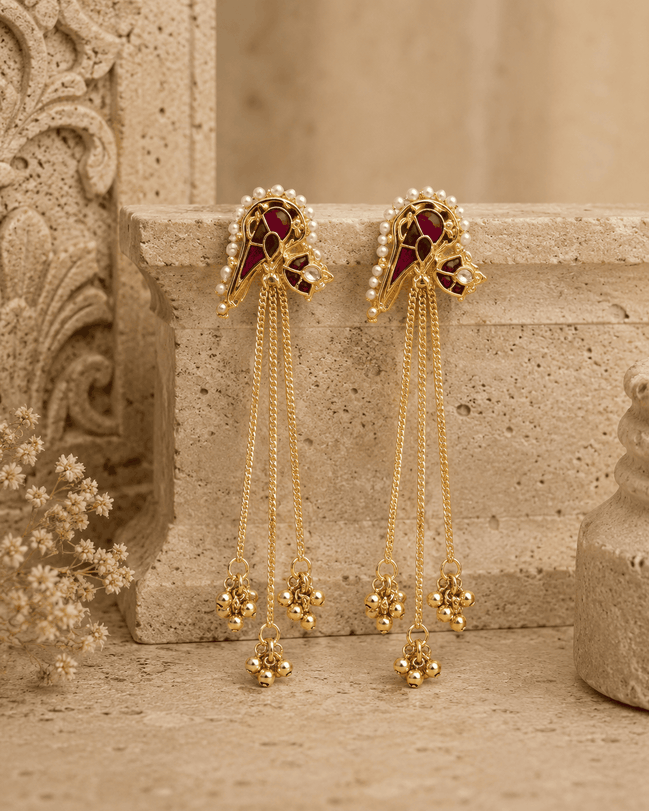 Gold-tone tassel earrings with ruby-pink and teal cabochon studs and long bead fringe chains