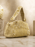 Gold-tone beaded crystal top handle bag with pearl-like bead detailing and chain strap