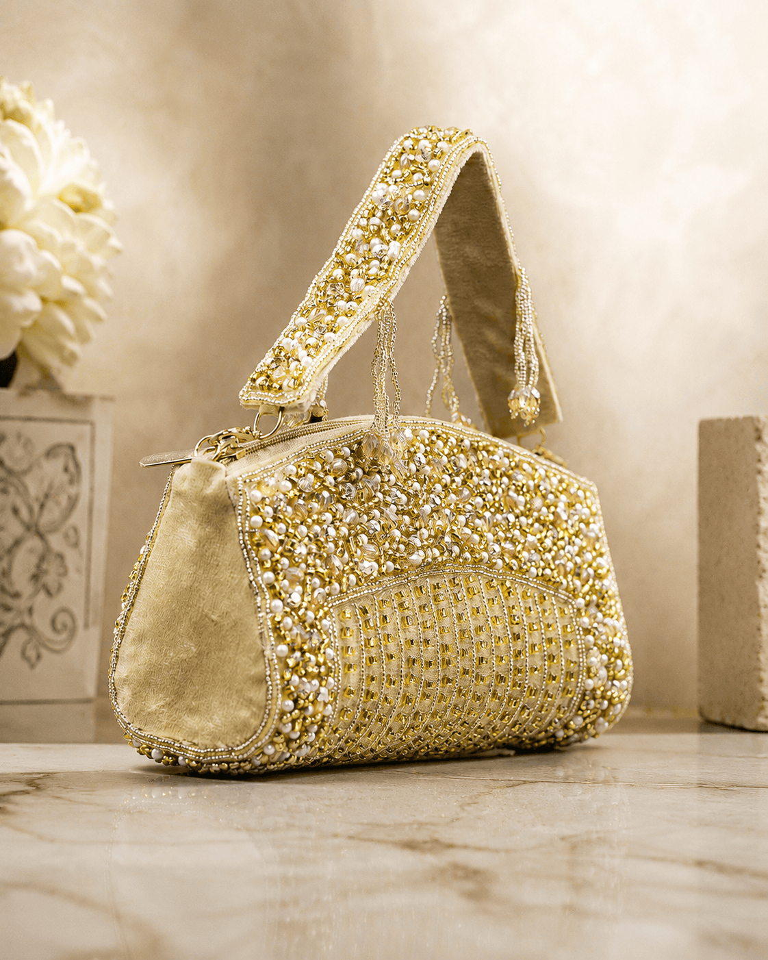 Gold-tone beaded crystal top handle bag with pearl-like bead detailing and chain strap