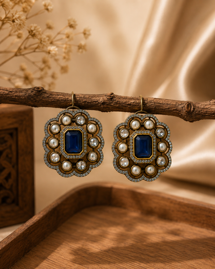 Royal Heritage pearl stud earrings with deep blue square center and decorative pearl halo