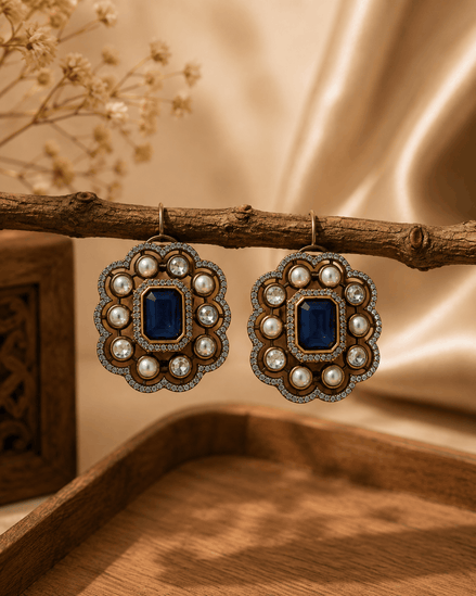Royal Heritage pearl stud earrings with deep blue square center and decorative pearl halo