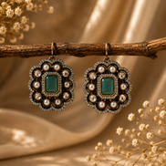 Royal Heritage pearl stud earrings with emerald-green square center and ornate pearl setting