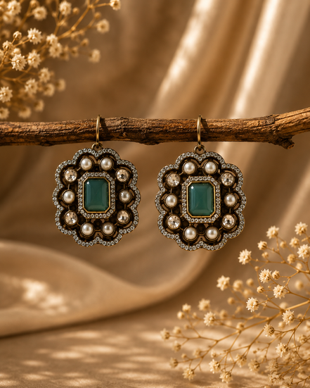 Royal Heritage pearl stud earrings with emerald-green square center and ornate pearl setting