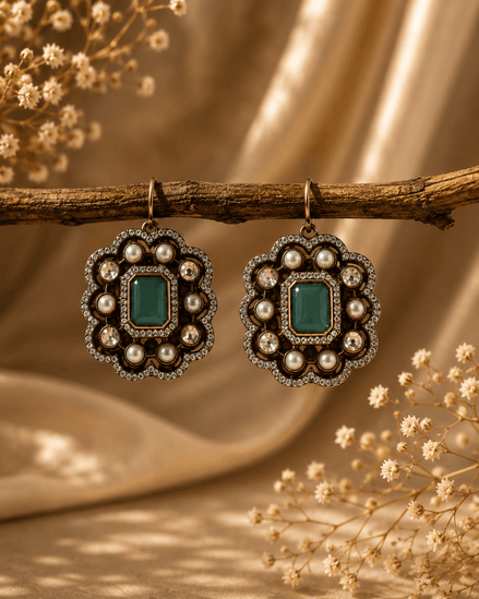 Royal Heritage pearl stud earrings with emerald-green square center and ornate pearl setting