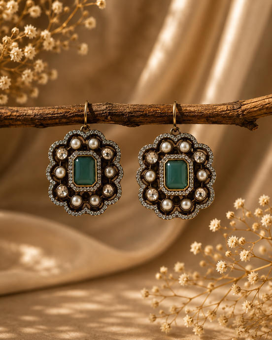 Royal Heritage pearl stud earrings with emerald-green square center and ornate pearl setting