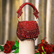Red crystal mini bag with beaded top handles and fringed front drape