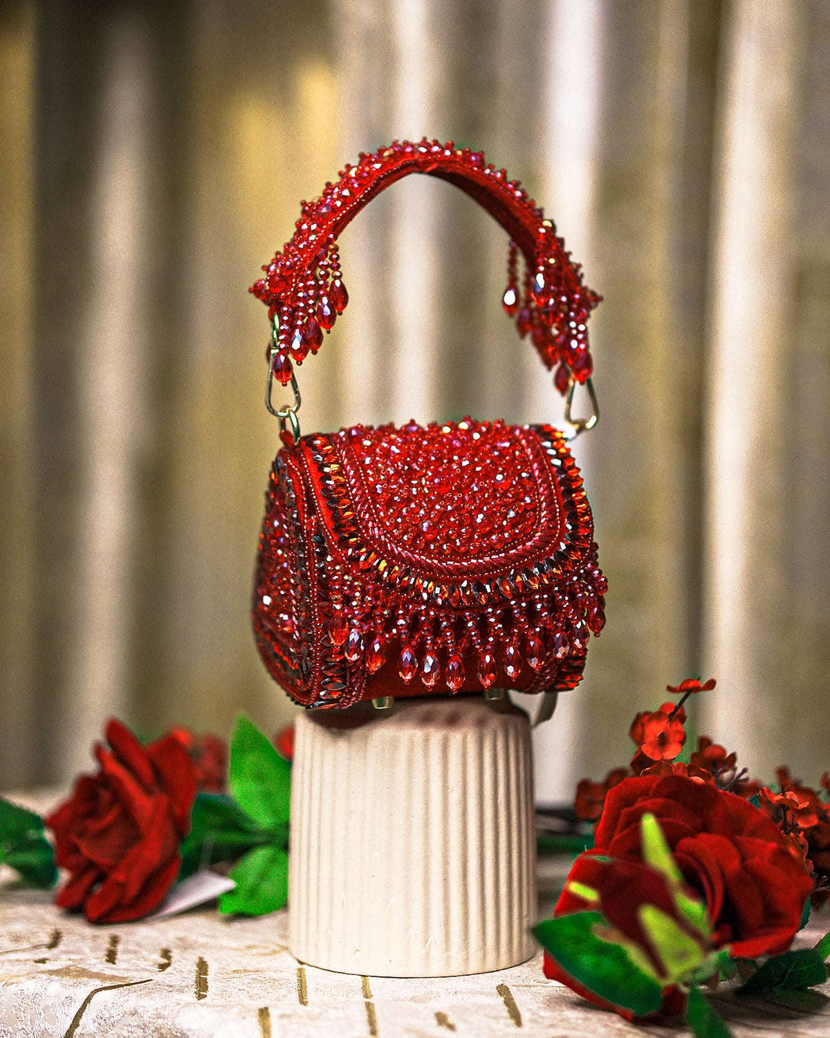 Red crystal mini bag with beaded top handles and fringed front drape