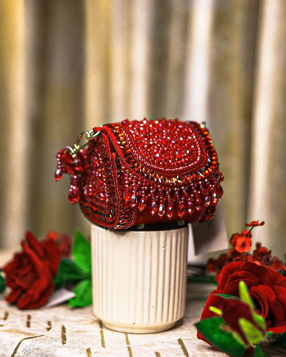 Red crystal mini shoulder bag with rounded flap and gold-tone chain handle