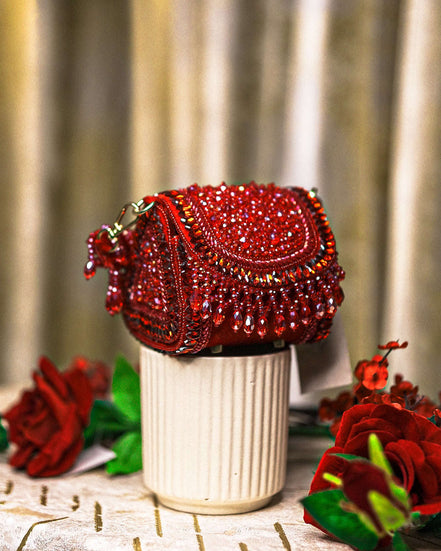 Red crystal mini shoulder bag with rounded flap and gold-tone chain handle