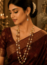 Gold-tone mala necklace set with pink, green, and red beads and matching drop earrings
