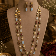 Gold-tone mala necklace with pink, light-blue, and red beads plus matching drop earrings on bust