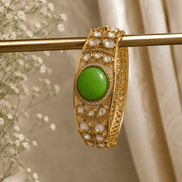 Vintage royal cuff bracelet gold tone with green oval center and bezel crystal stones