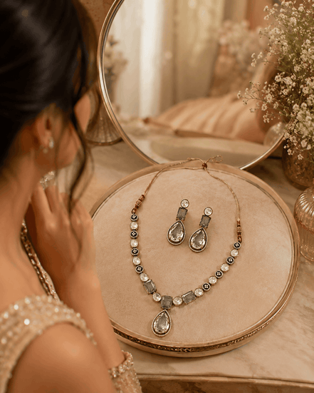 Clear teardrop crystal necklace with pearl-like bead rows and stud drop earrings