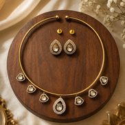 Gold-tone necklace and oval drop earrings set with crystal-like accents