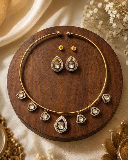 Gold-tone necklace and oval drop earrings set with crystal-like accents