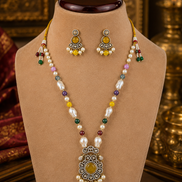 Beaded mala set with white pearls, yellow and green accents, gold center pendant