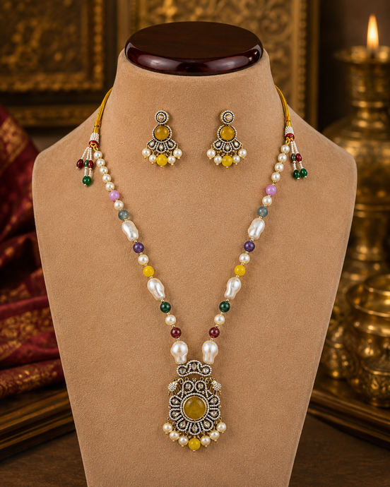 Beaded mala set with white pearls, yellow and green accents, gold center pendant